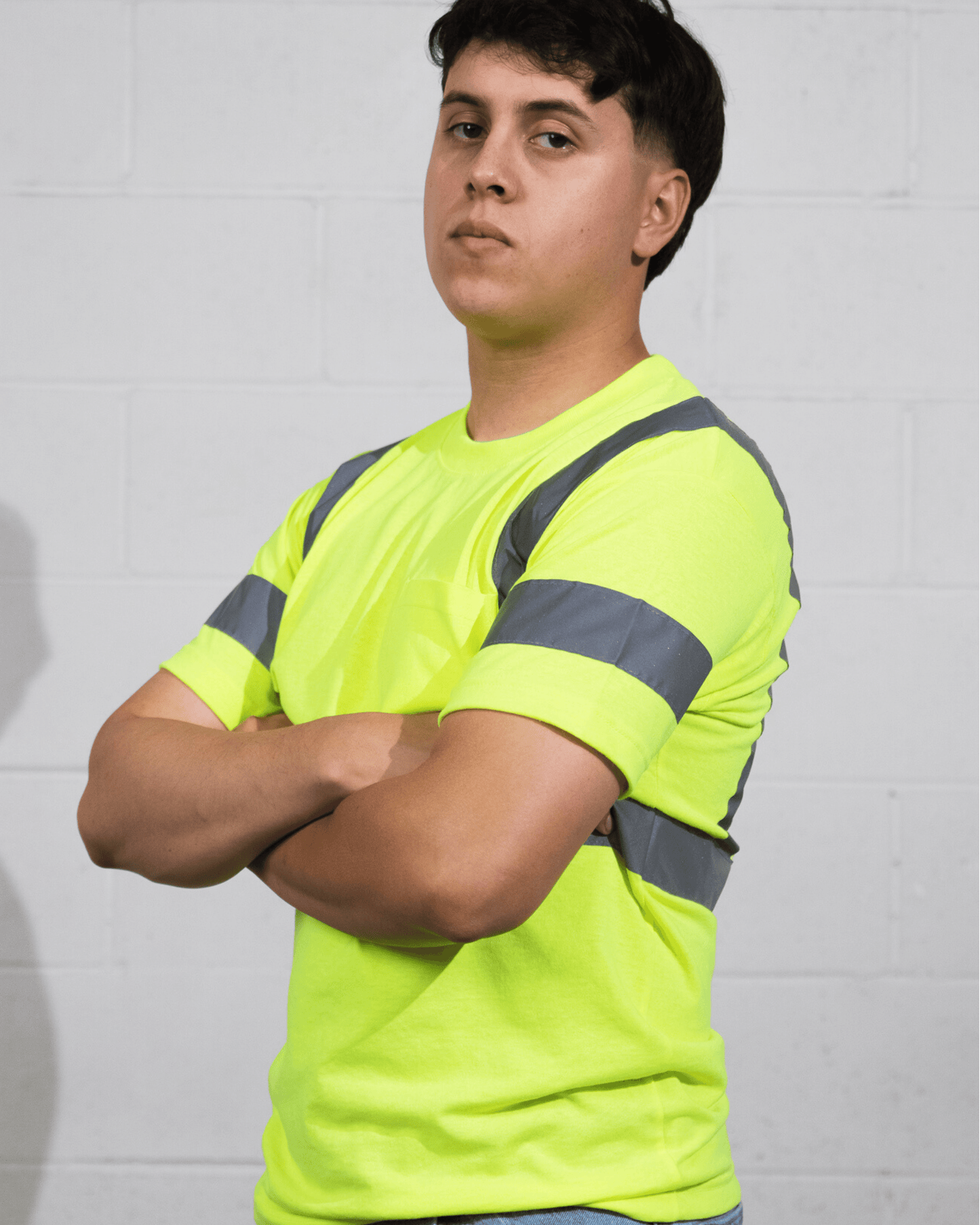 A man wearing Suna Cotton® Safety Green Reflective T-shirt