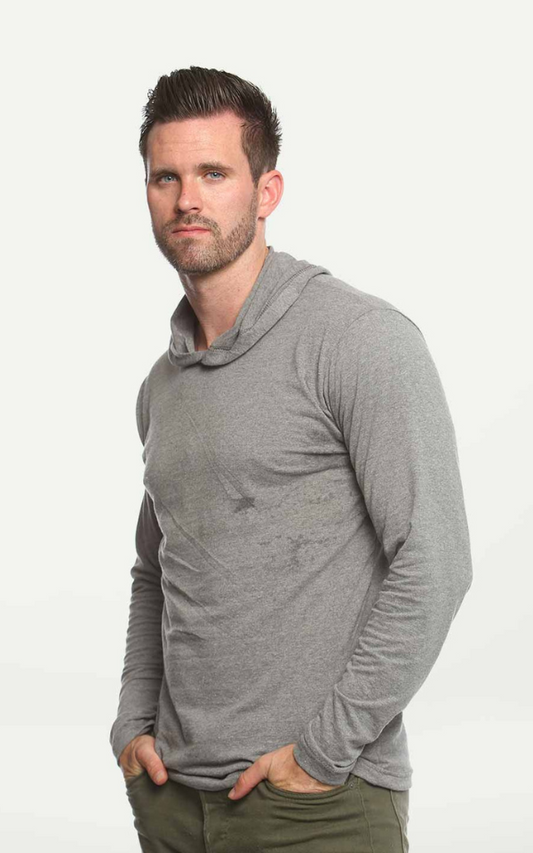 Man wearing a Suna Cotton® Heather Grey Long Sleeve Hooded T-shirt