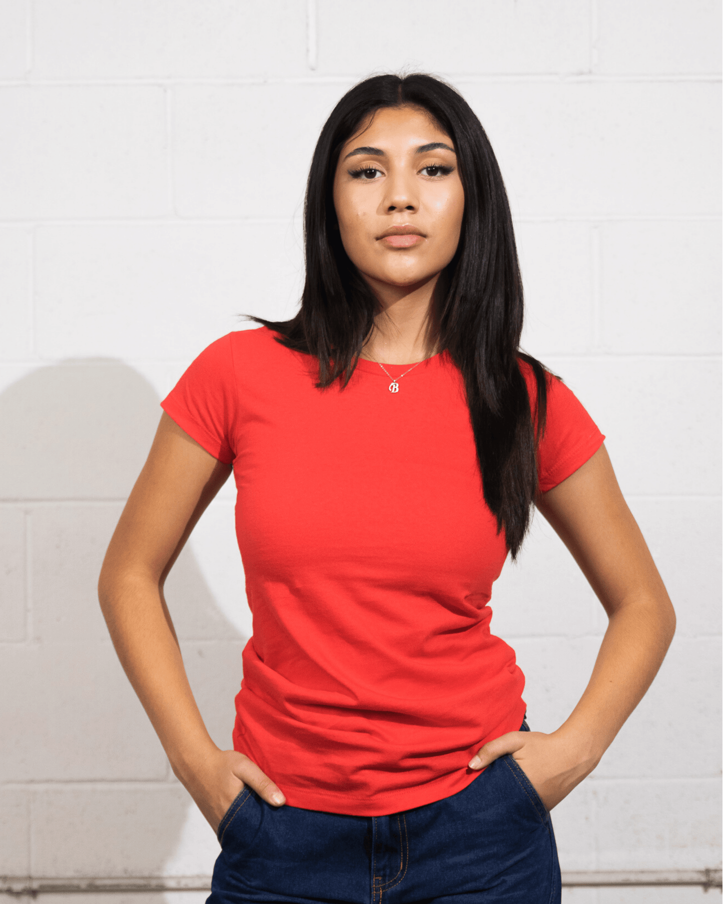 Woman wearing a Red Suna Cotton® Ladies Junior Fit T-shirt