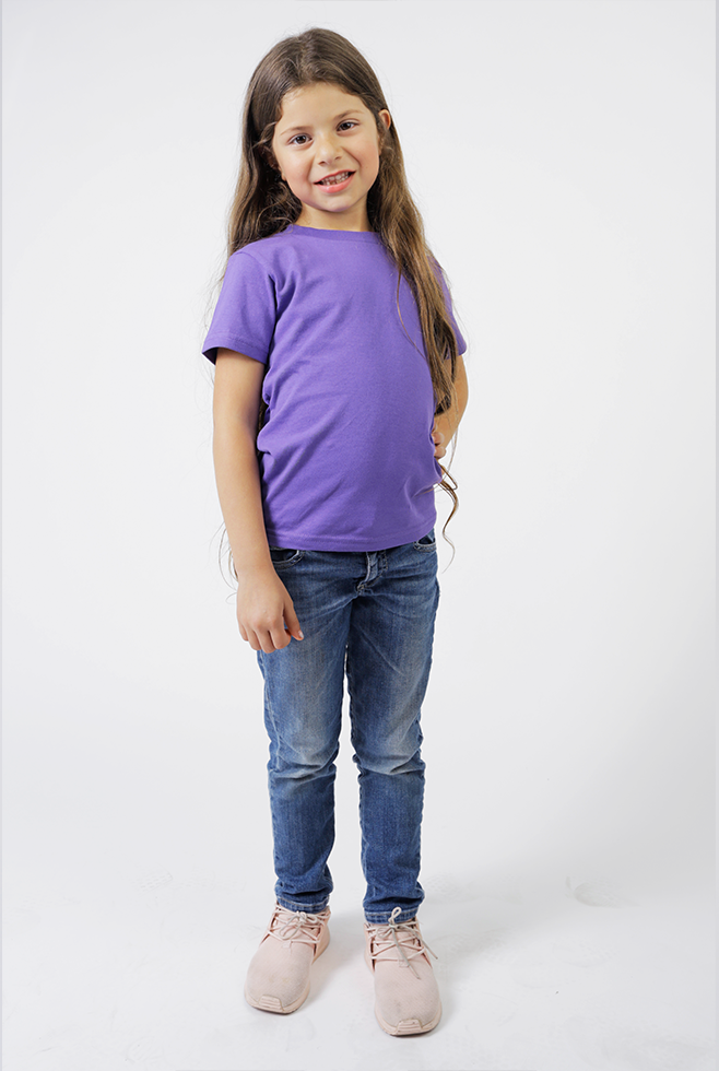 A young girl wearing a Suna Cotton® Purple  Toddler Tee