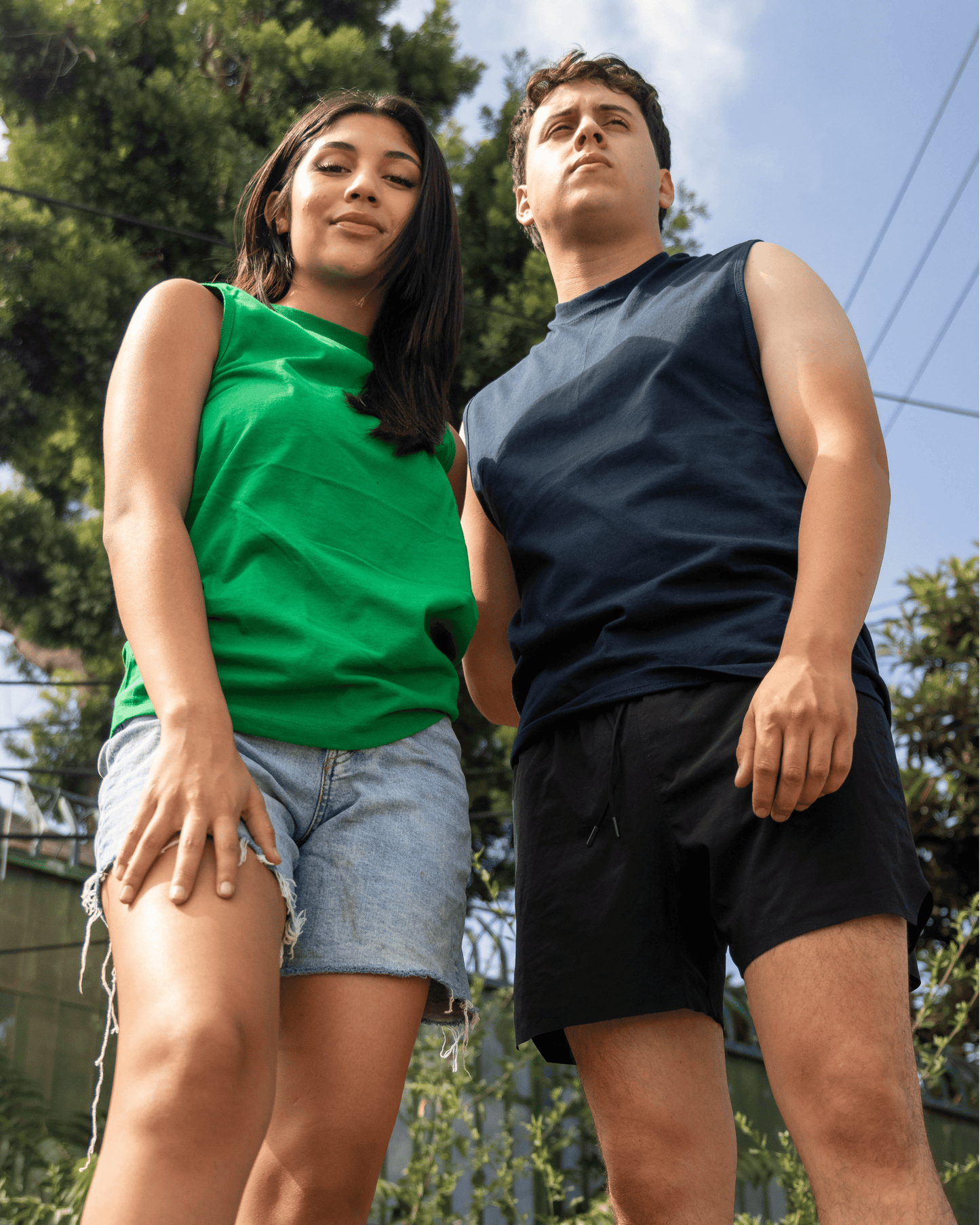 A Man and Woman wearing Suna Cotton® Adult Muscle Tee in green and navy blue